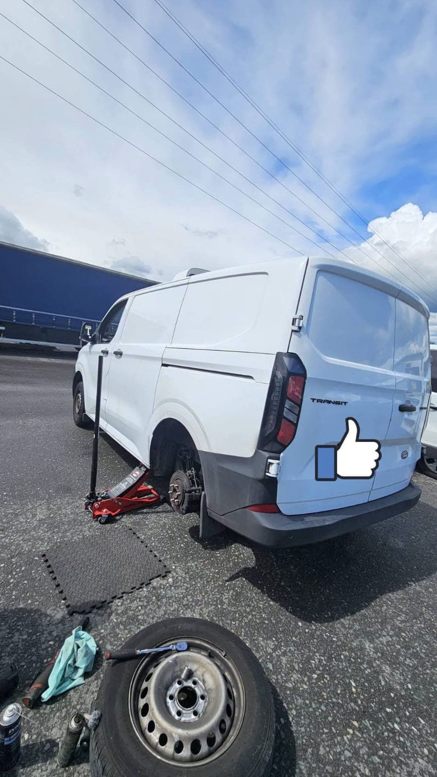 Mobile mechanic servicing vehicle